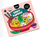 Coloring notebook titled 'Cozy Yummy' by OMY with cartoon food illustrations on a pink background.