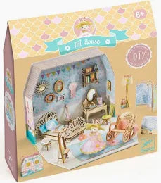 Merry Woodland Magnetic Dress-Up toy packaging featuring a colorful illustrated fox in a Christmas-themed forest scene with a red header and product title at the top.
