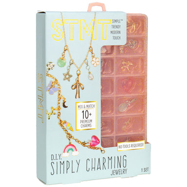 Simply Charming STMT jewelry making kit in its original packaging, featuring a light blue box with gold lettering and a pink translucent resin mold tray visible inside.