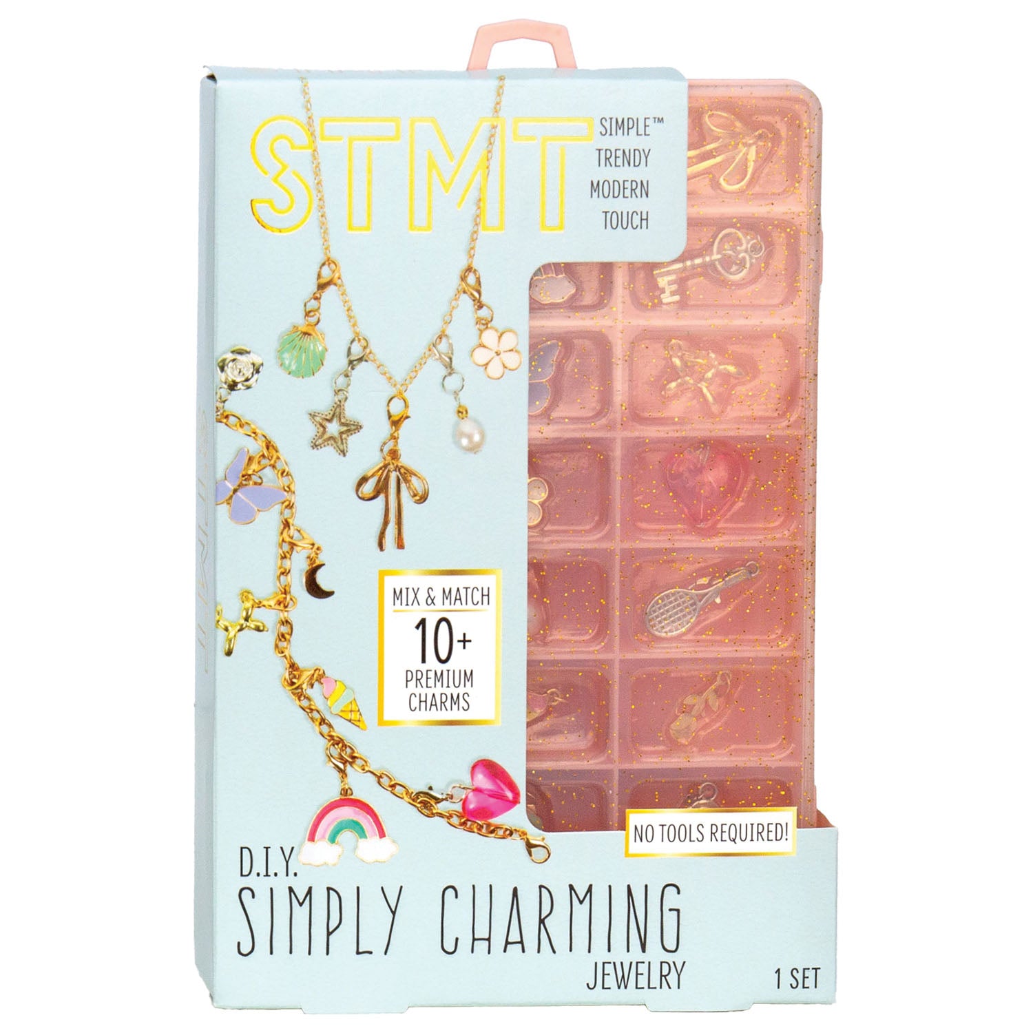 Simply Charming STMT DIY Jewelry kit in its retail packaging, featuring a light blue box with gold lettering and a pink translucent plastic charm tray visible behind it.