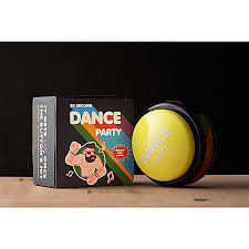 Yellow 'Dance Party' ball with packaging on a wooden surface