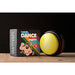 Yellow 'Dance Party' ball with packaging on a wooden surface