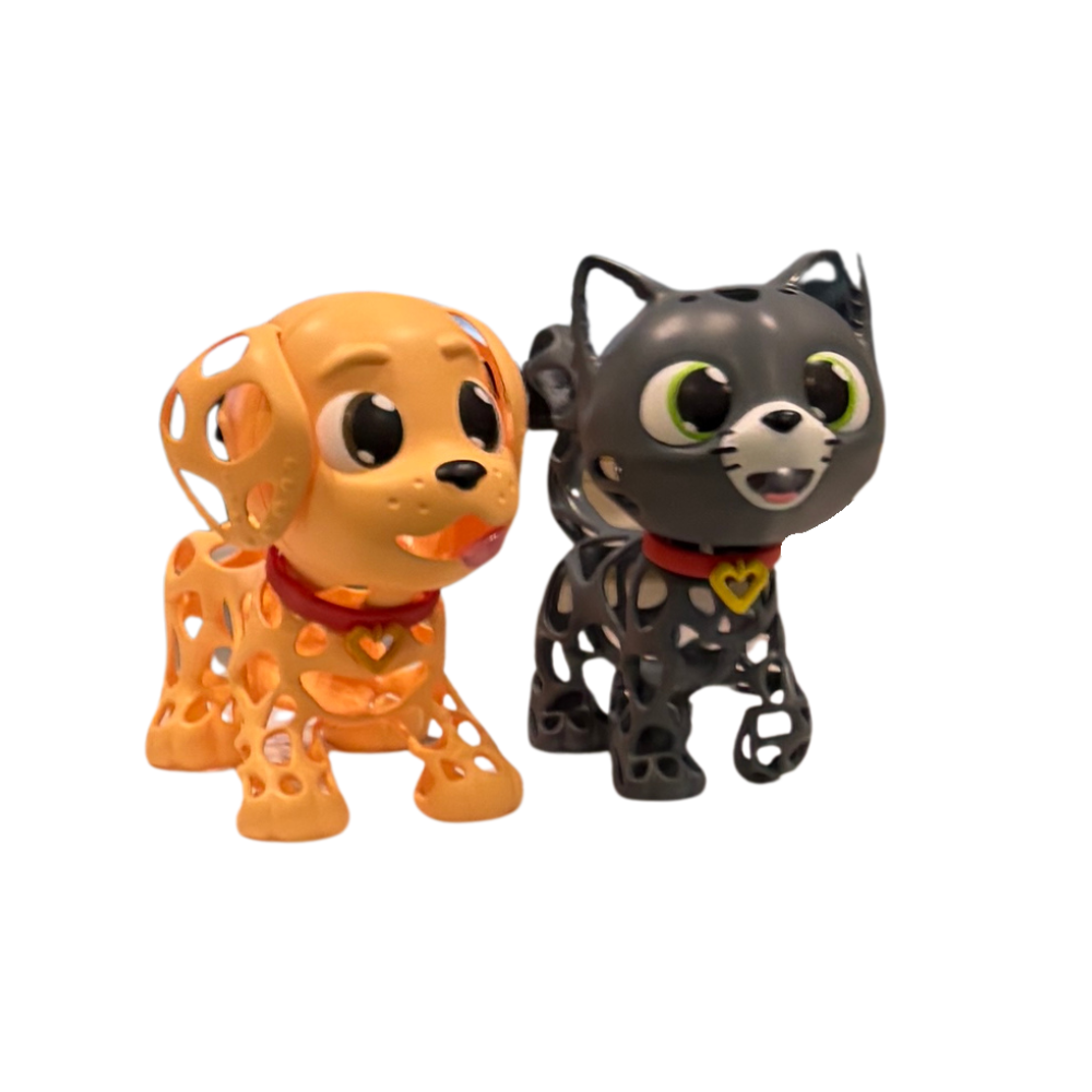 Two toy figures, one orange dog and one black cat, on a white background