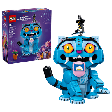 Blue toy figure with large eyes and a LEGO box in the background
