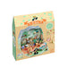 A toy building block set in its original packaging, featuring a colorful illustration of a forest cottage scene on the box front.