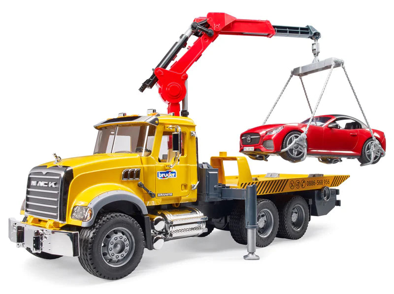 Toy tow truck with crane lifting a red car on a white background