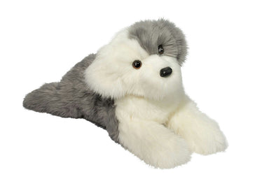 Plush toy seal lying on a white background