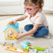 Child playing with colorful building blocks on a carpeted floor