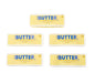 Five packages of Same Butter extra whipped buttercream and softened butter arranged on a plain white background.