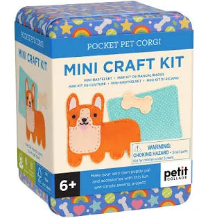 Petit Collage Pocket Pet Corgi Mini Craft Kit in a blue and white cardboard box with colorful star-patterned edges and illustrations of a corgi and fabric pieces.