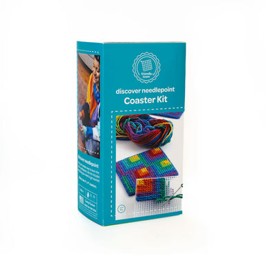 Boxed needlepoint coaster kit with colorful coaster and turquoise box on a white background