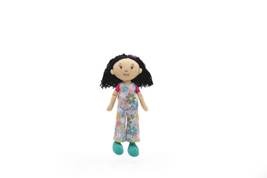 Plush doll with black hair and floral outfit on a white background