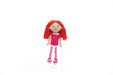 Toy doll with red hair and pink outfit on a white background