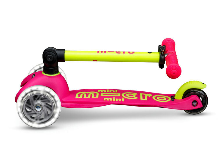 Pink and yellow scooter with 'mini micro' branding on a white background
