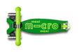Green scooter with 'maxi micro' branding on a white background