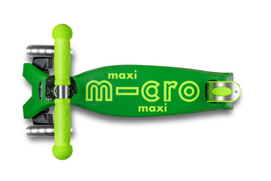 Green scooter with 'maxi micro' branding on a white background