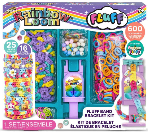 Rainbow Loom Fluff Band Bracelet Kit in its retail packaging, featuring a teal plastic organizer filled with colorful rubber bands, beads, and accessories, alongside illustrations of finished bracelets.