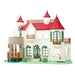 Toy model of a detailed house with red roofs and wooden balconies on a white background
