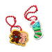 Two Christmas-themed acrylic keychains on red ball chains. One keychain features a cute gingerbread man and gingerbread woman figure with a yellow border.
