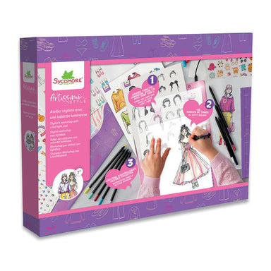 Swingware Artissimo Fashion Design kit in a purple box, showing fashion illustration sheets, black and white sketch pencils, and hands drawing a fashion illustration.