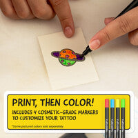 Coloring a small tattoo design on a piece of paper with markers, including text about the product.
