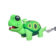 Green turtle-shaped toy with a keychain on a white background