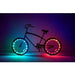 A black bicycle with glowing LED wheel lights in blue, green, yellow, orange, and red, set against a dark background with a purple gradient glow.